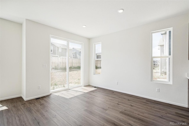 13392 E 110th Way, Commerce City, CO 80022 - empty room featuring dark wood finished floors, baseboards, and recessed lighting