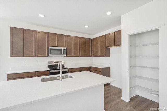 13392 E 110th Way, Commerce City, CO 80022 - kitchen with stainless steel appliances, a sink, light countertops, dark wood-style flooring, and recessed lighting