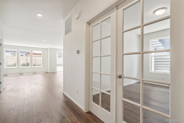 13392 E 110th Way, Commerce City, CO 80022 - hallway featuring wood finished floors, french doors, baseboards, and recessed lighting