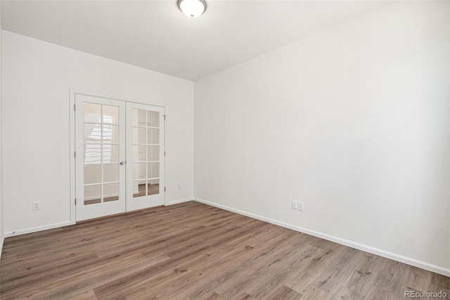 13392 E 110th Way, Commerce City, CO 80022 - unfurnished room featuring wood finished floors, french doors, and baseboards