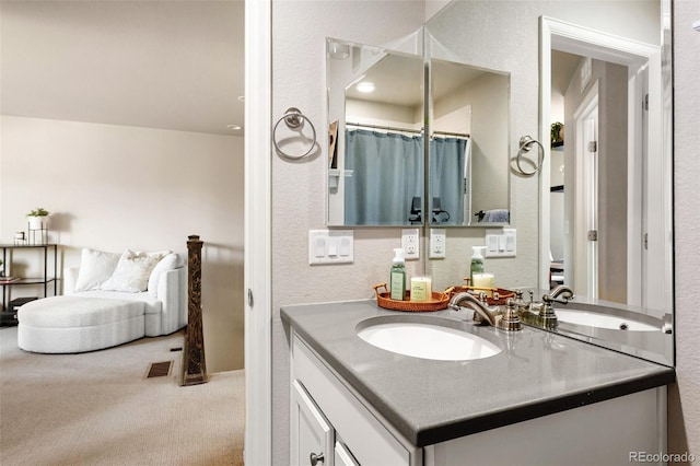14833 E Crestridge Dr, Centennial, CO 80015 - full bathroom featuring vanity and a textured wall
