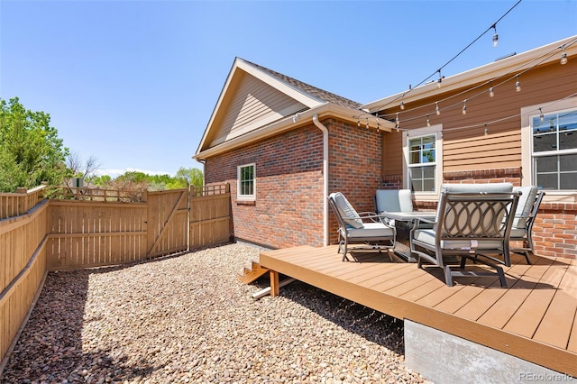 14833 E Crestridge Dr, Centennial, CO 80015 - wooden terrace featuring a gate and outdoor dining area
