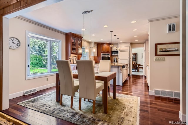10130 E Powers Ave, Greenwood Village, CO 80111 - dining space with dark wood-style floors, ornamental molding, and recessed lighting