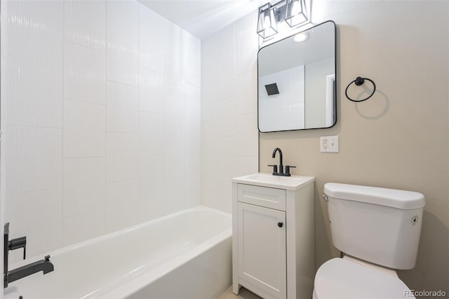 full bathroom featuring vanity, tiled shower / bath combo, and toilet