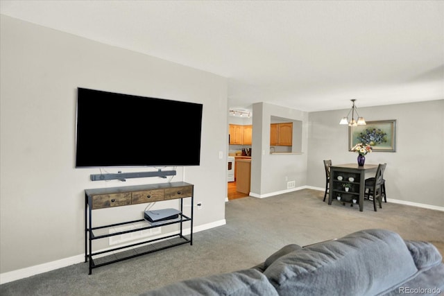 13271 Holly St Unit B, Thornton, CO 80241 - living room with carpet floors and a chandelier