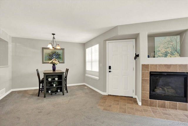 13271 Holly St Unit B, Thornton, CO 80241 - carpeted dining area with baseboards and a tiled fireplace