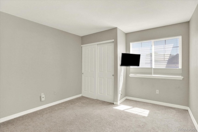 13271 Holly St Unit B, Thornton, CO 80241 - unfurnished bedroom featuring carpet and a closet