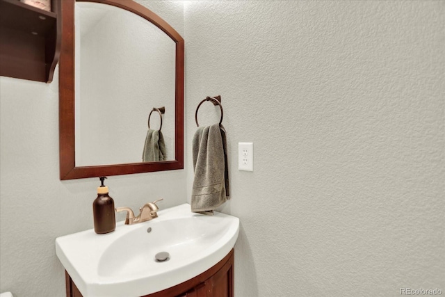 13271 Holly St Unit B, Thornton, CO 80241 - bathroom with vanity and a textured wall