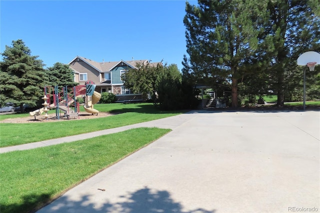 13271 Holly St Unit B, Thornton, CO 80241 - view of front facade featuring a playground and a front lawn