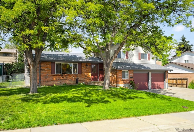 9325 Meade St, Westminster, CO 80031 - view of front of property with concrete driveway, brick siding, and an attached garage