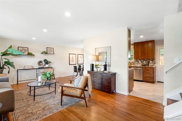9325 Meade St, Westminster, CO 80031 - living area featuring light wood finished floors and recessed lighting