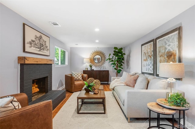 9325 Meade St, Westminster, CO 80031 - living room featuring a fireplace, wood finished floors, and recessed lighting