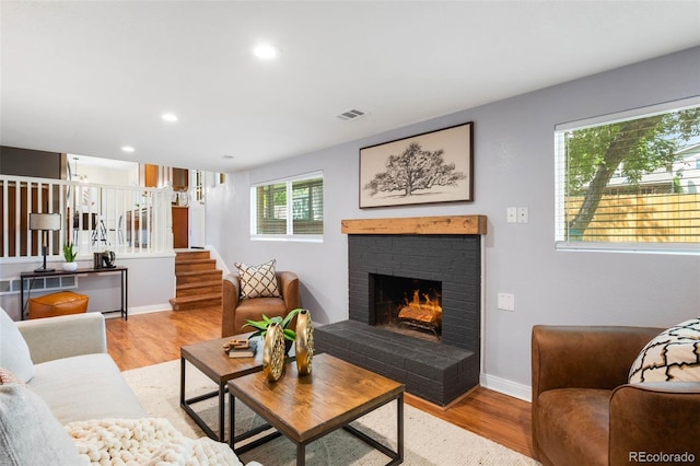 9325 Meade St, Westminster, CO 80031 - living area with wood finished floors, a fireplace, recessed lighting, and stairway