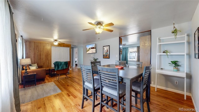 dining space featuring hardwood / wood-style flooring and ceiling fan