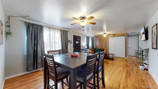 dining area featuring light hardwood / wood-style flooring and ceiling fan