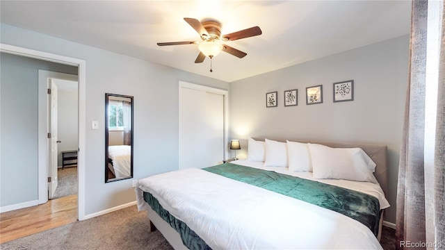 bedroom with a closet, ceiling fan, and carpet