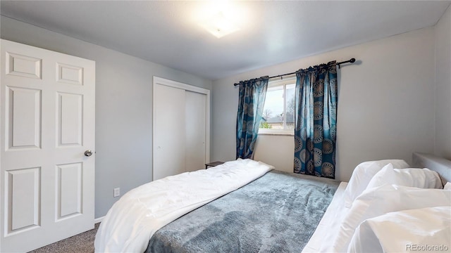 carpeted bedroom with a closet