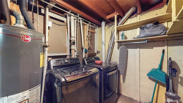 utility room featuring washer and dryer and water heater