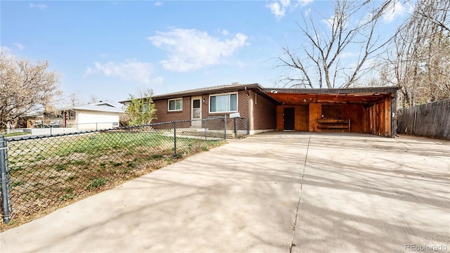 single story home featuring a carport and a front yard