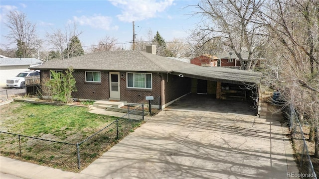 ranch-style house featuring a carport and a front yard