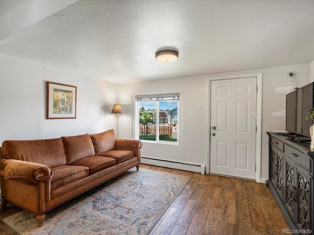 3134 W Center Ave, Denver, CO 80219 - living room featuring a baseboard radiator and dark wood-style floors