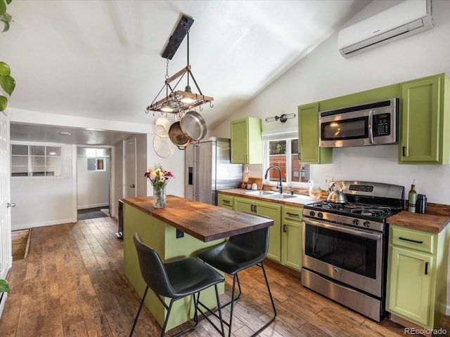 3134 W Center Ave, Denver, CO 80219 - kitchen featuring wooden counters, green cabinetry, and lofted ceiling