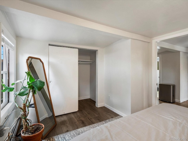 3134 W Center Ave, Denver, CO 80219 - bedroom with wood finished floors, baseboards, and a closet