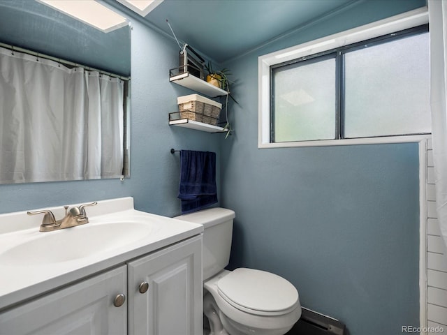 3134 W Center Ave, Denver, CO 80219 - bathroom featuring toilet, vanity, and curtained shower