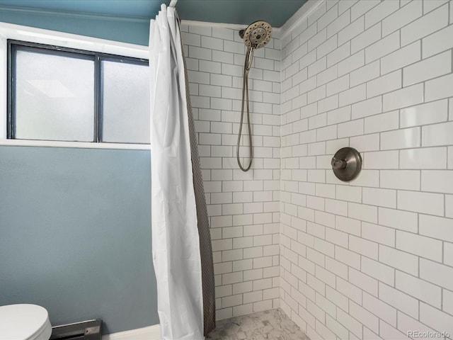 3134 W Center Ave, Denver, CO 80219 - bathroom with a tile shower, toilet, and baseboards