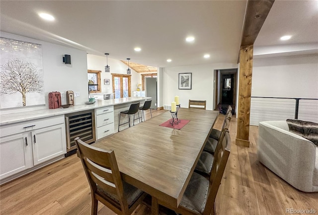 dining room with light wood-type flooring and wine cooler