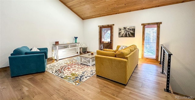 living room featuring hardwood / wood-style floors, lofted ceiling, and wooden ceiling