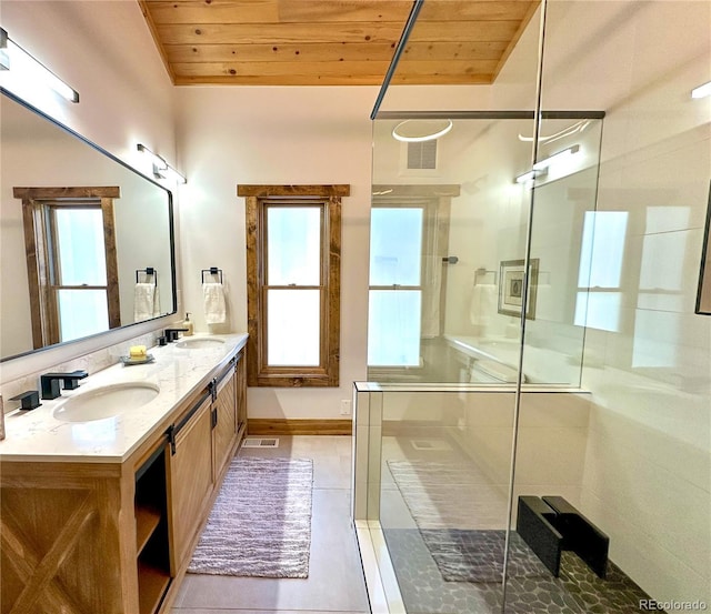 bathroom with tile patterned flooring, vanity, wood ceiling, and walk in shower