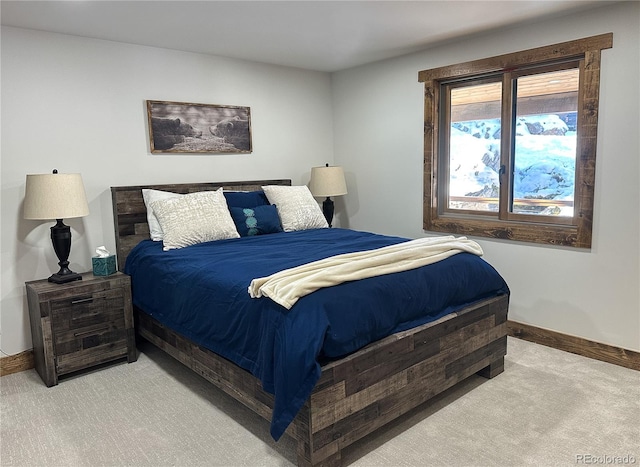 bedroom featuring light carpet