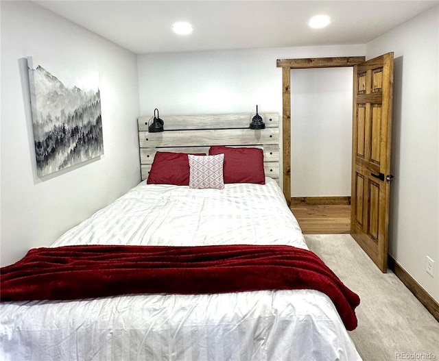 bedroom featuring light carpet