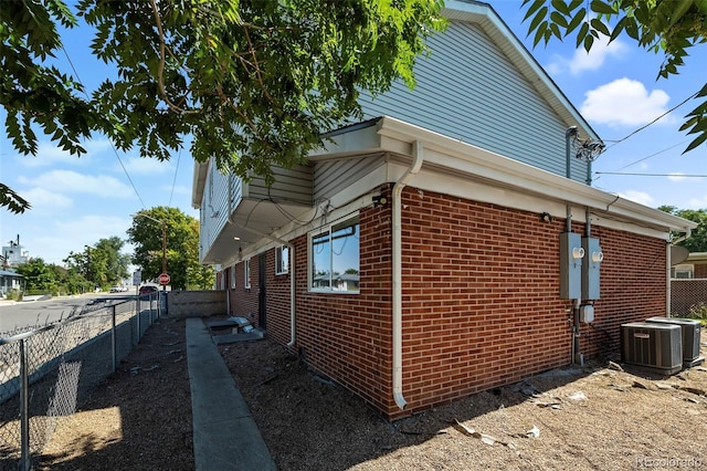 view of side of property with central AC unit