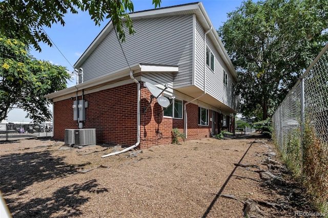 view of side of property featuring cooling unit