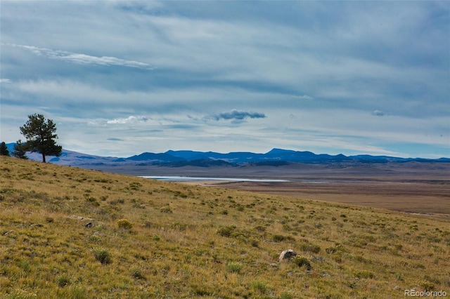 view of mountain feature featuring a water view