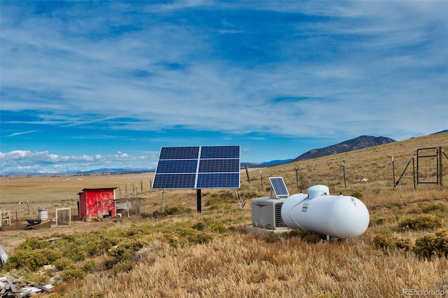 view of yard featuring a rural view and a mountain view