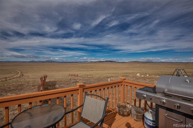 1888 Lakeview Dr, Lake George, CO 80827 - wooden deck featuring area for grilling, a view of rural / pastoral area, a mountain view, and outdoor dining space