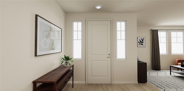 entrance foyer with light hardwood / wood-style floors and plenty of natural light