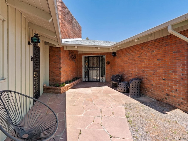 10400 W 35th Pl, Wheat Ridge, CO 80033 - property entrance with brick siding and a patio