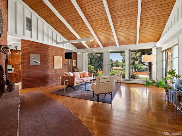 10400 W 35th Pl, Wheat Ridge, CO 80033 - living room with wood finished floors, high vaulted ceiling, brick wall, and a wood ceiling with exposed beams