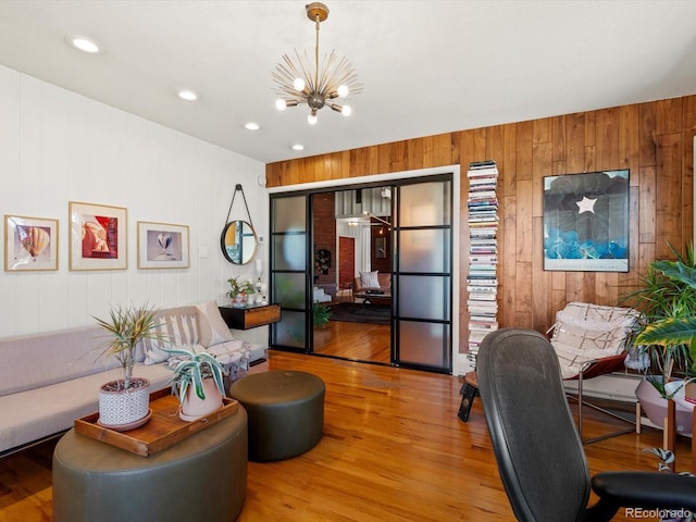 10400 W 35th Pl, Wheat Ridge, CO 80033 - living area featuring wooden walls, a chandelier, wood finished floors, and recessed lighting