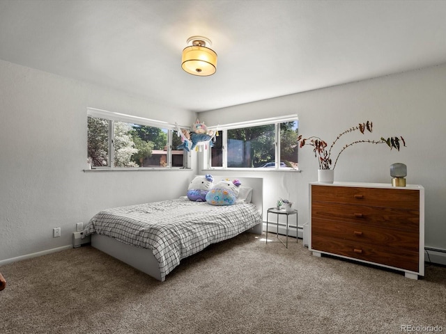 10400 W 35th Pl, Wheat Ridge, CO 80033 - bedroom with multiple windows, carpet flooring, and a baseboard heating unit