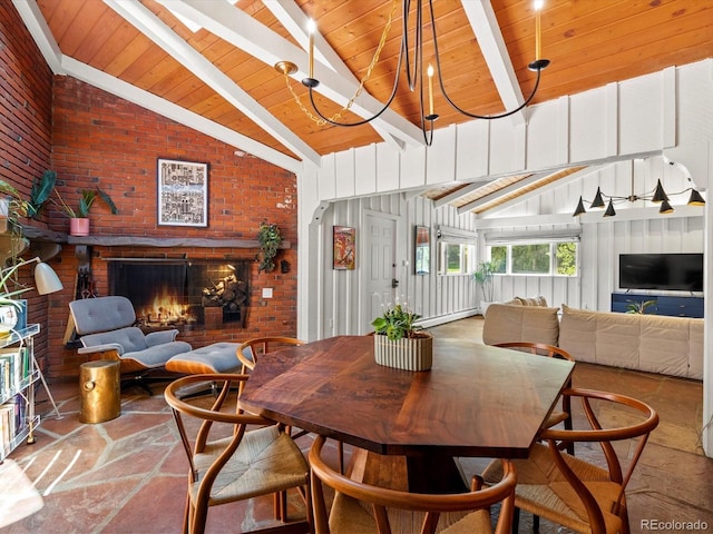 10400 W 35th Pl, Wheat Ridge, CO 80033 - dining room with brick wall, stone floors, wooden ceiling, and a fireplace
