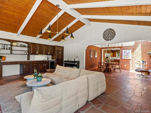 10400 W 35th Pl, Wheat Ridge, CO 80033 - living area with stone tile floors, a wooden ceiling with exposed beams, high vaulted ceiling, and wood walls