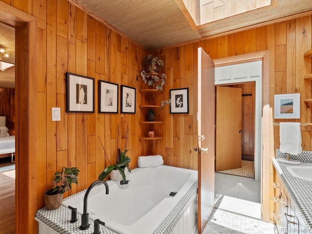10400 W 35th Pl, Wheat Ridge, CO 80033 - full bath with wood walls, a tub to relax in, wood ceiling, and vanity