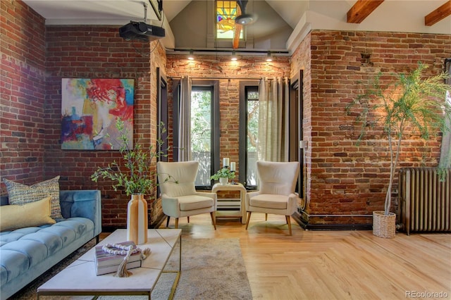 3259 W Hayward Pl, Denver, CO 80211 - living room featuring brick wall, radiator, and high vaulted ceiling