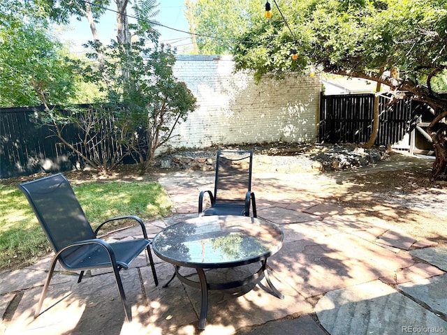 3259 W Hayward Pl, Denver, CO 80211 - fenced backyard with a patio and an outdoor fire pit
