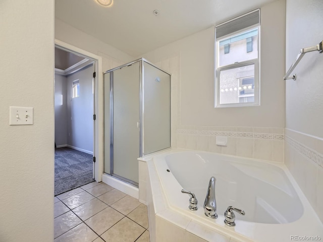 bathroom featuring tile patterned flooring, crown molding, and shower with separate bathtub